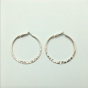 Classic hammered hoop earrings.